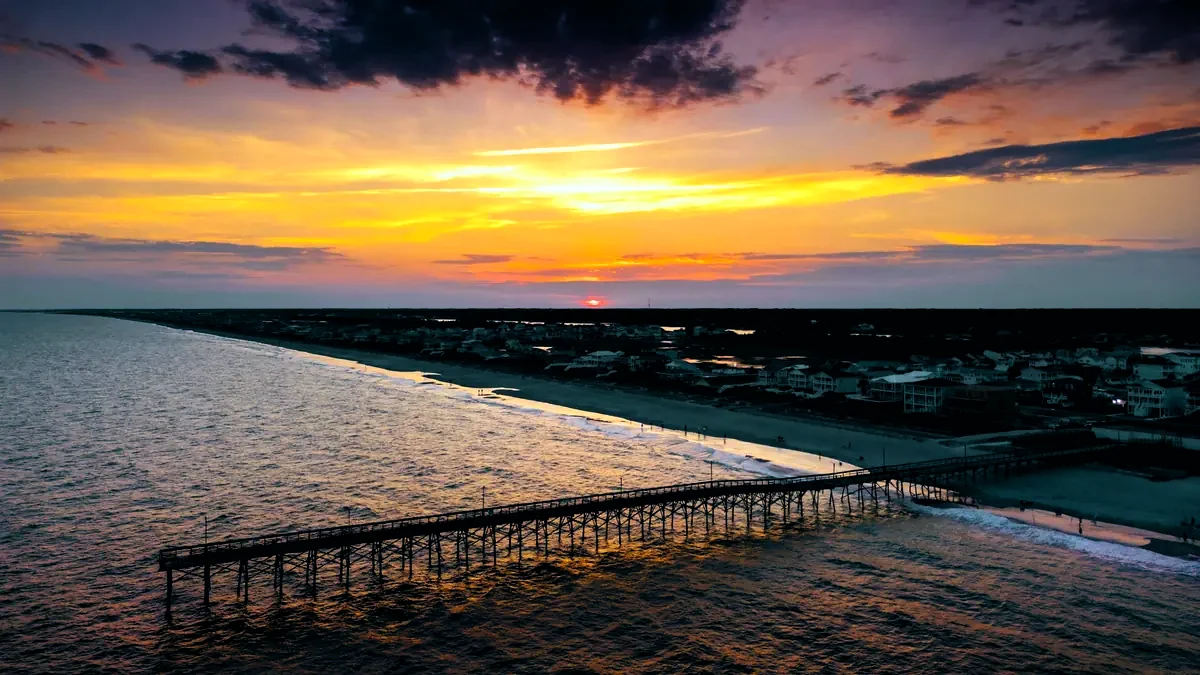 Sunset over Holden Beach and its pier